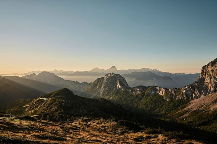 Mountain range during the sunrise near Falkensteiner Hotels