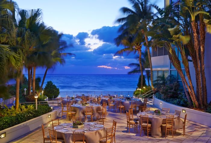 Dining tables in South Palm Court at The Diplomat Resort