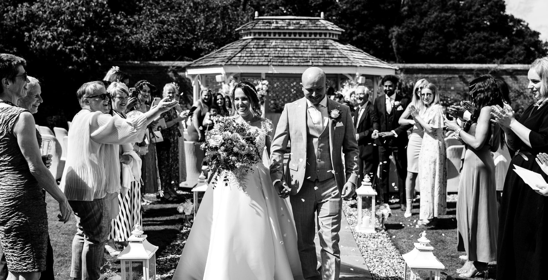 A wedding ceremony held outdoors at Easthampstead Park Hotel