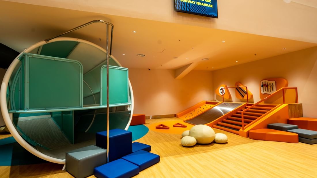 Modern children's play area with slides, climbing, and soft play elements in bright colors near Sunway Hotel Big Box