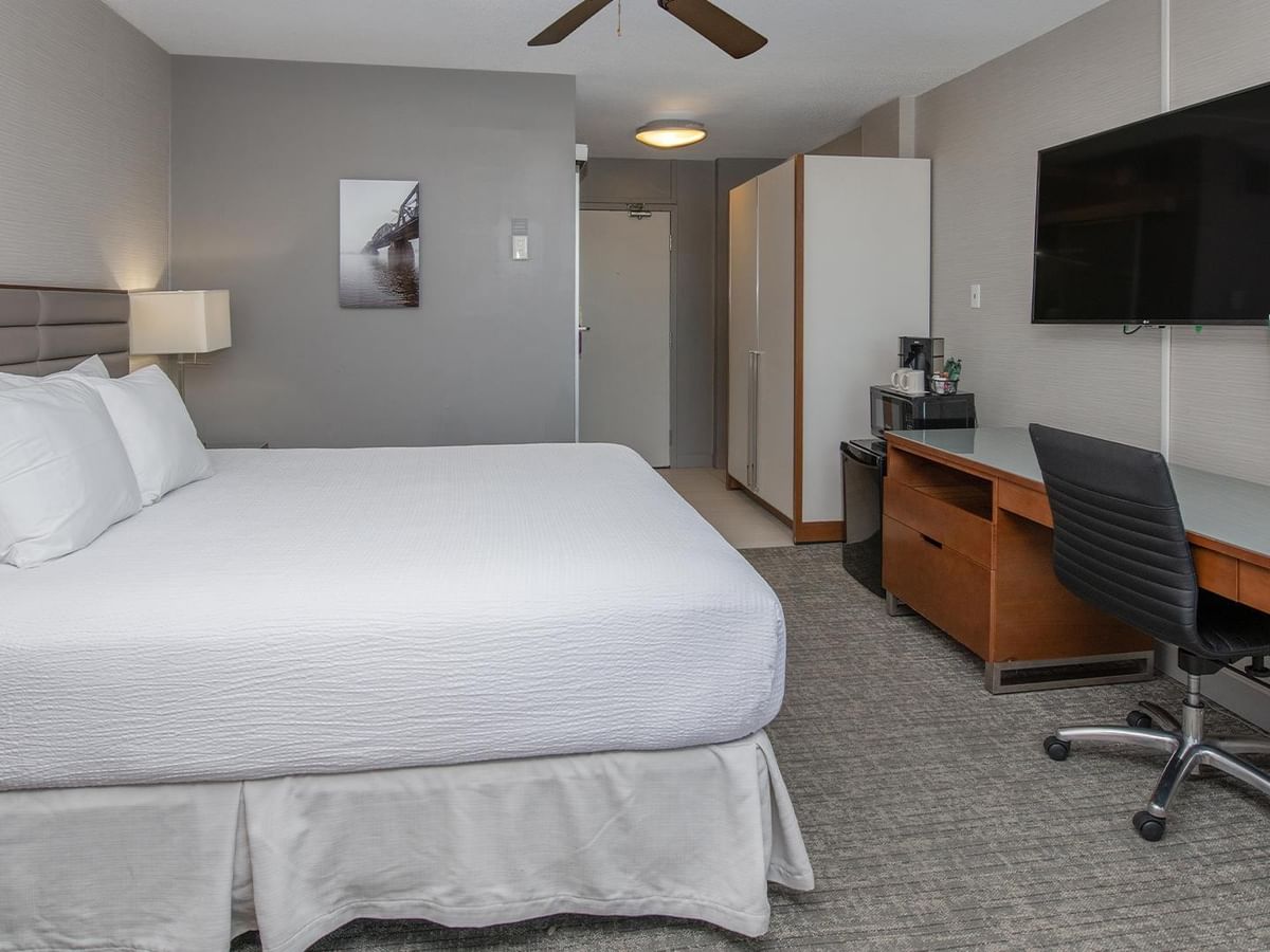Coast King room with king bed, work desk, flat-screen TV, and modern furnishings at Coast Prince George Hotel.