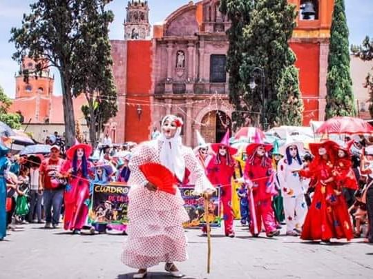 People gathered for a ceremony near Fiesta Americana Travelty