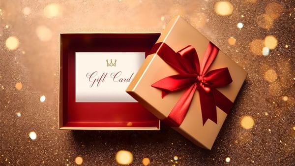 Gift box with a red bow and e-gift card at Warwick Hotels and Resorts