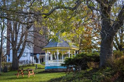 Charming outdoor gazebo and picnic tables at Rodd Grand Yarmouth, a scenic choice among hotels in Yarmouth