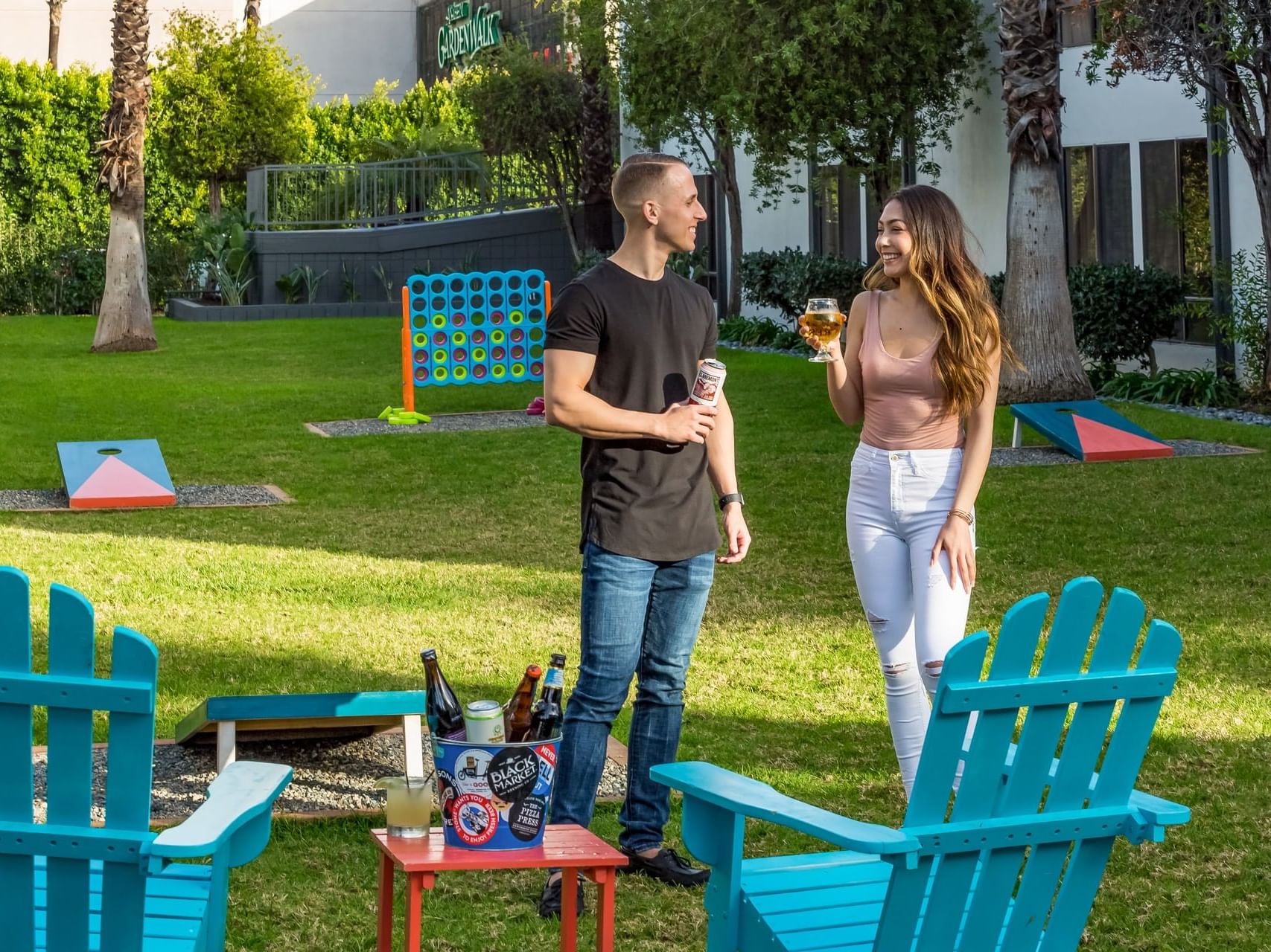 Couple enjoying a drink in recreation area, The Anaheim Hotel