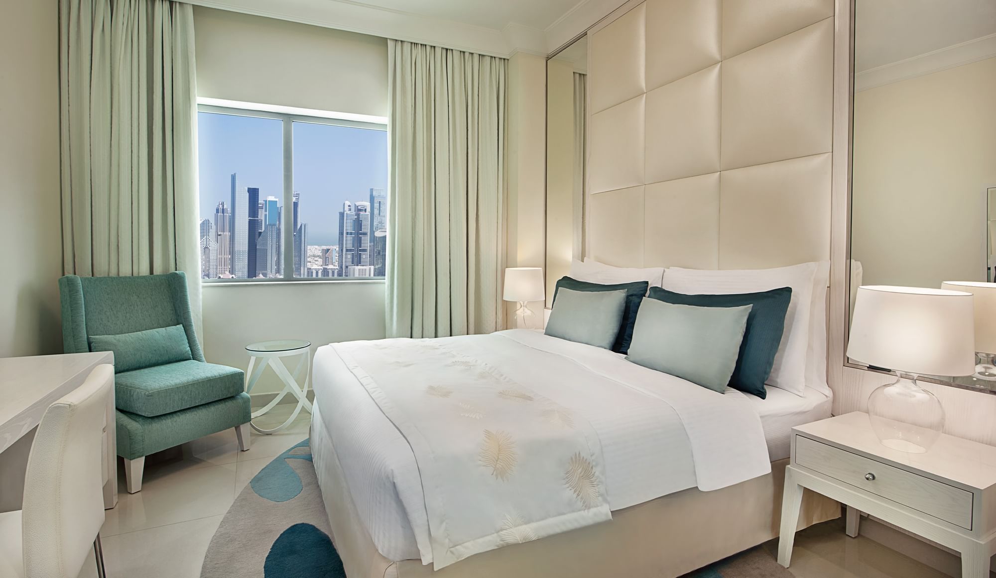 Bed with nightstand and city-view Two Bedroom Suite, hotel rooms in Dubai at DAMAC Maison Dubai Mall Street