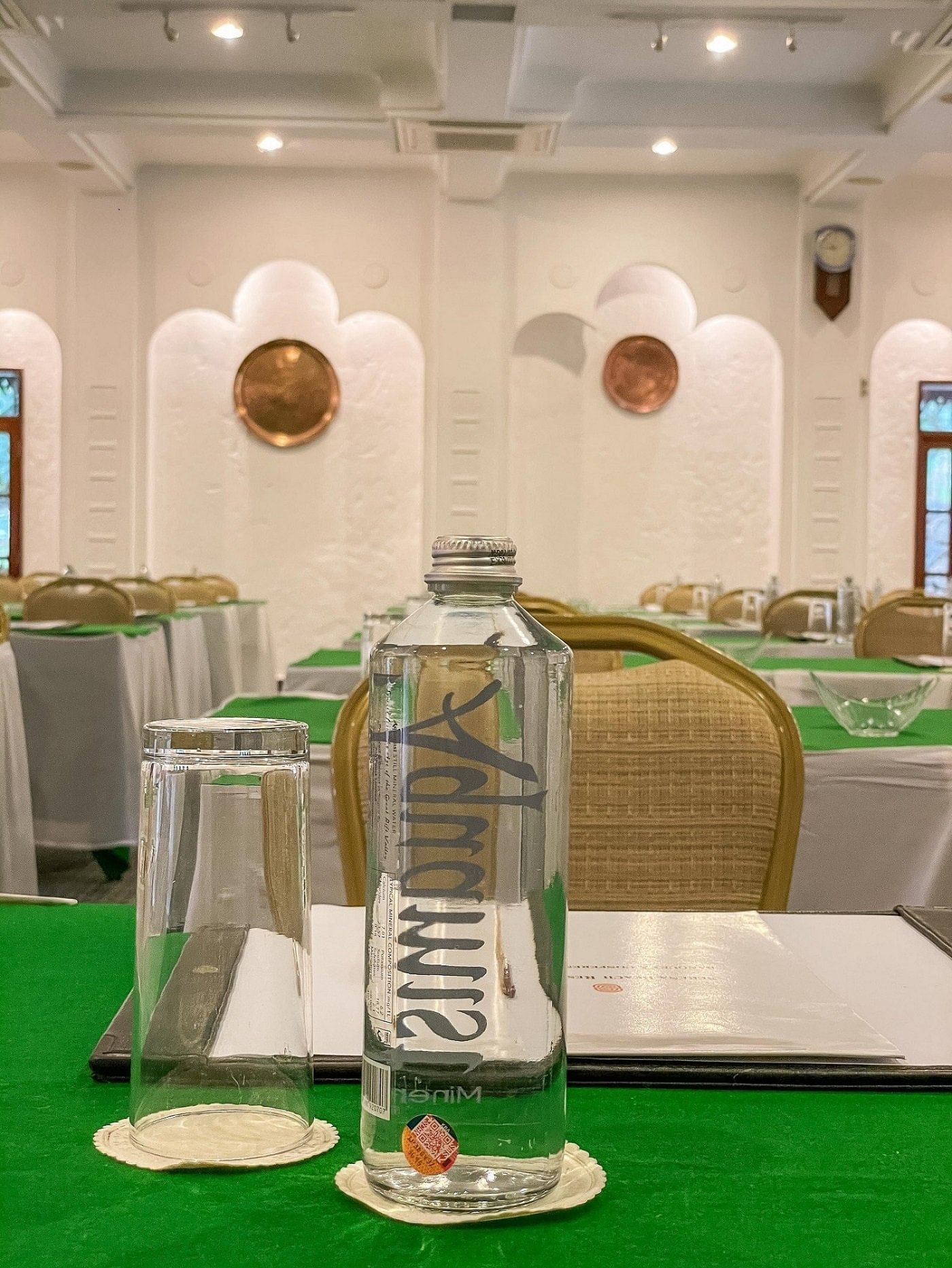 Water bottle on event room tables at Serena Beach Resort & Spa