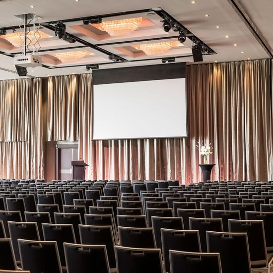 Theatre set-up in Grand Ballroom with carpeted floors at Pullman Albert Park