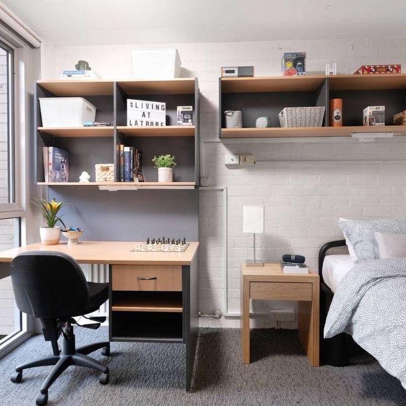 Comfortable single room with desk and bed at La Trobe University – Menzies College.