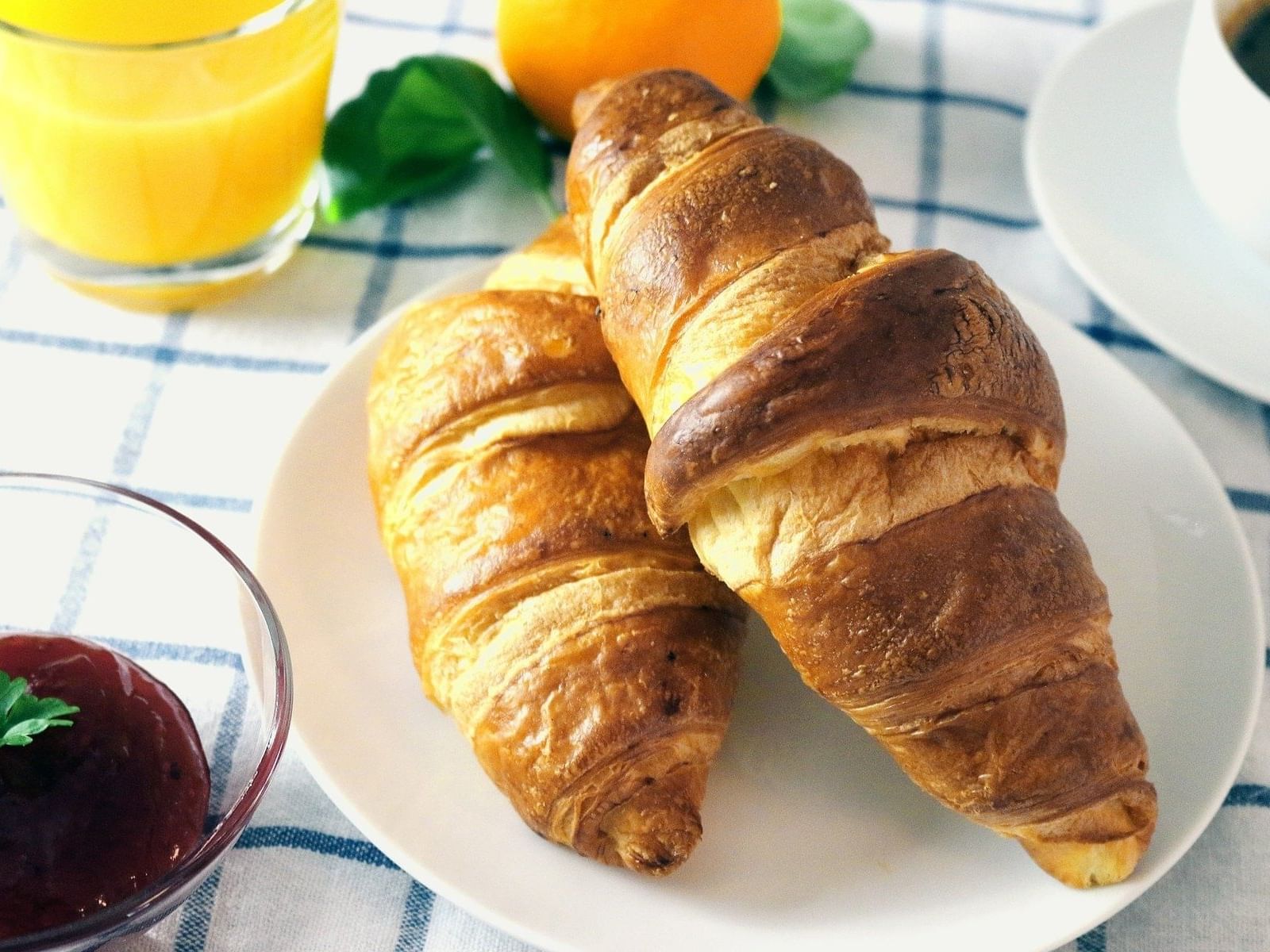 Close-up of two croissants served on a plate in Vie De France at Miami Lakes Hotel