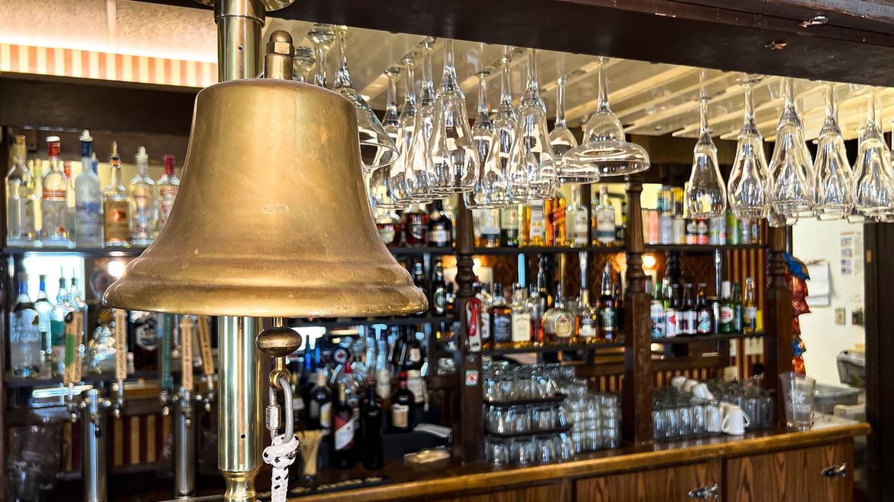 Bar with glasses and bottles of alcohol
