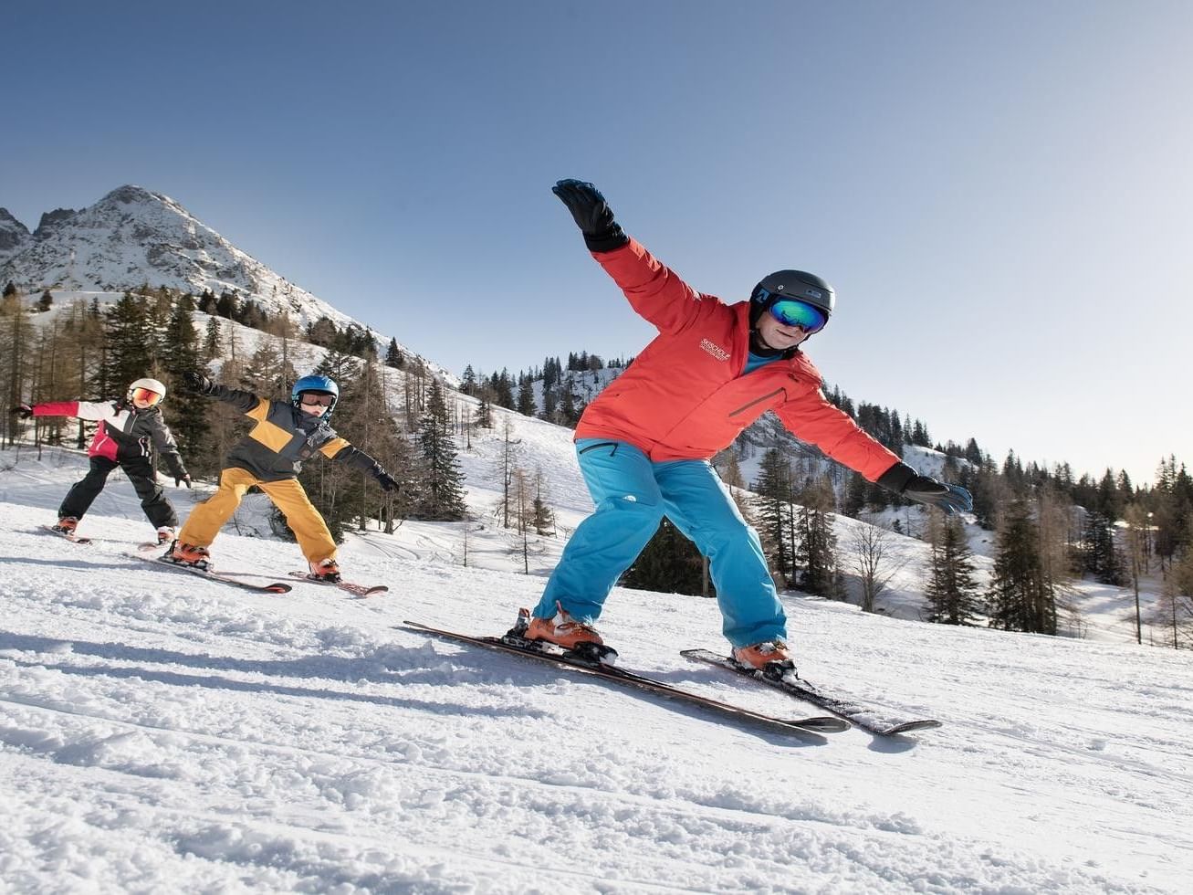 Skiing Family in ski region Dachstein West.