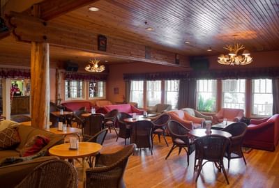 Fireside lounge dining area with table seating and couches