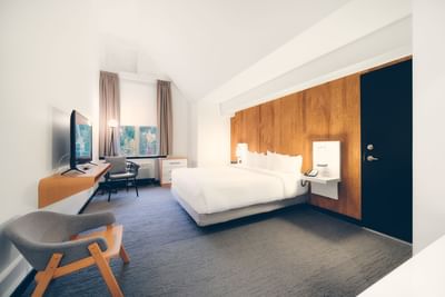 King bed, TV & loungers in Superior King at Aava Whistler Hotel