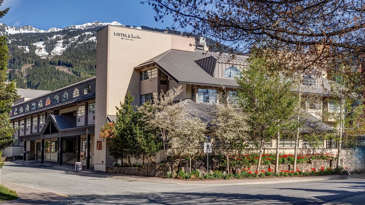 Listel Whistler, a Coast Hotel, hotel exterior during the summer