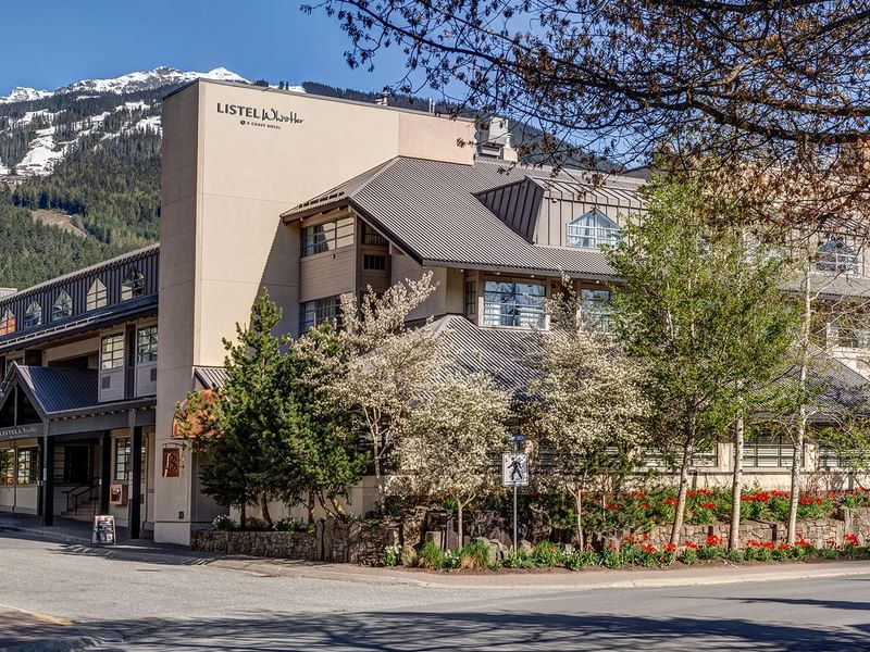 Listel Whistler, a Coast Hotel, hotel exterior during the summer