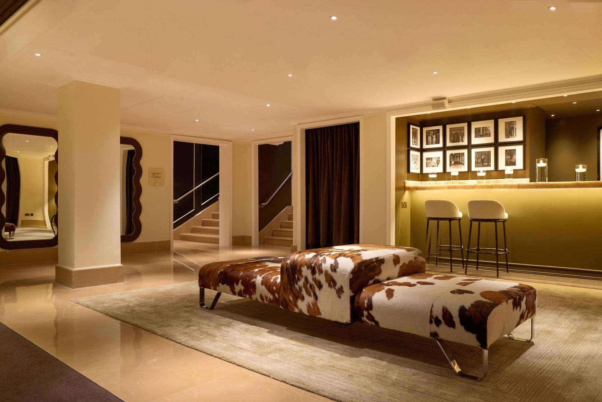 The Screening Room bar with cowhide benches at The May Fair Hotel, London.