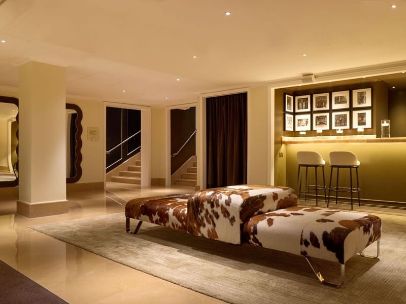 The Screening Room bar with cowhide benches at The May Fair Hotel, London.
