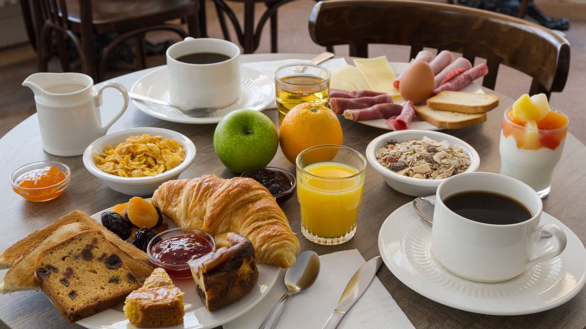 A warm breakfast served in a Restaurant at Originals Hotels
