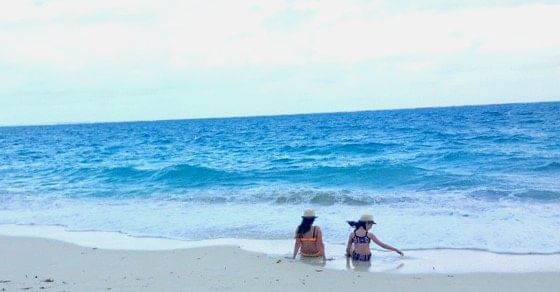 Two ladies enjoying in the beach near The Somerset On Grace Bay