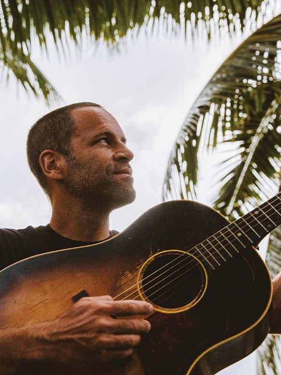 Jack Johnson playing the guitar