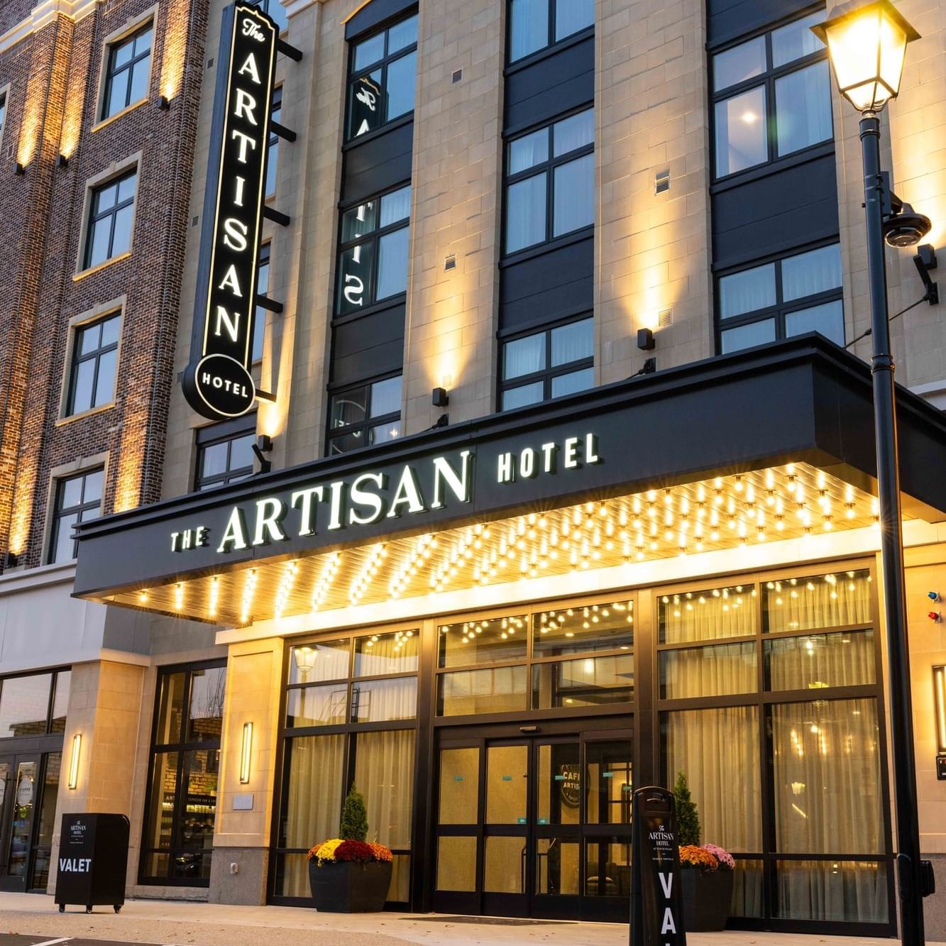 Exterior view of the hotel entrance at The Artisan Hotel at Tuscan Village
