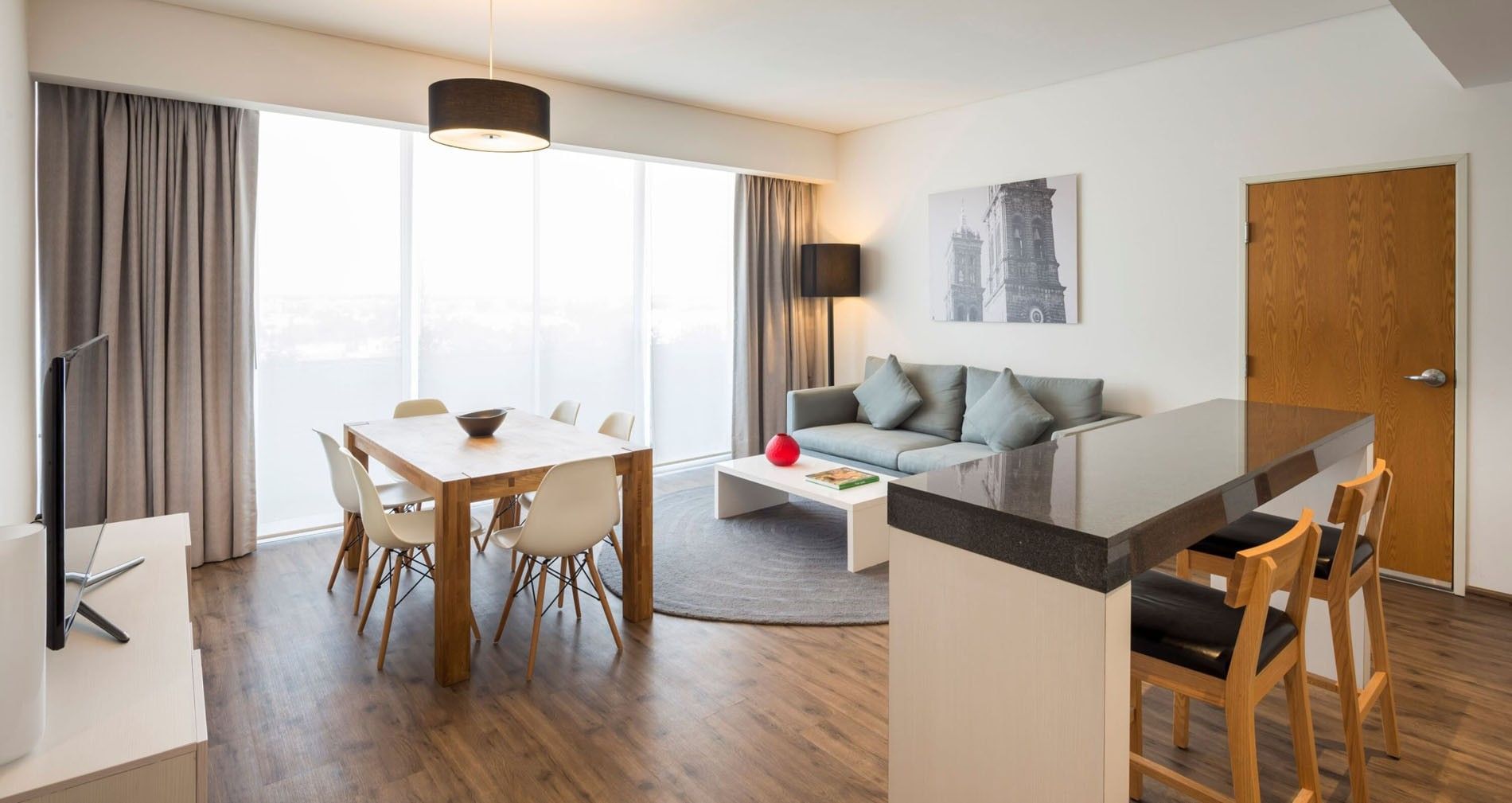 Modern King Suite 1 Room featuring a dining table and a cozy living space at Camino Real Puebla Angelopolis