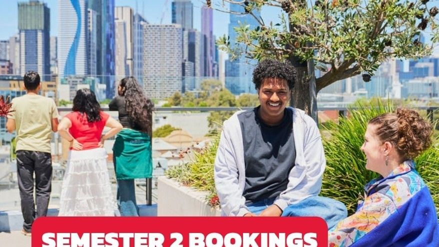 People sitting and walking in a relaxed outdoor space at UniLodge Royal Melbourne.