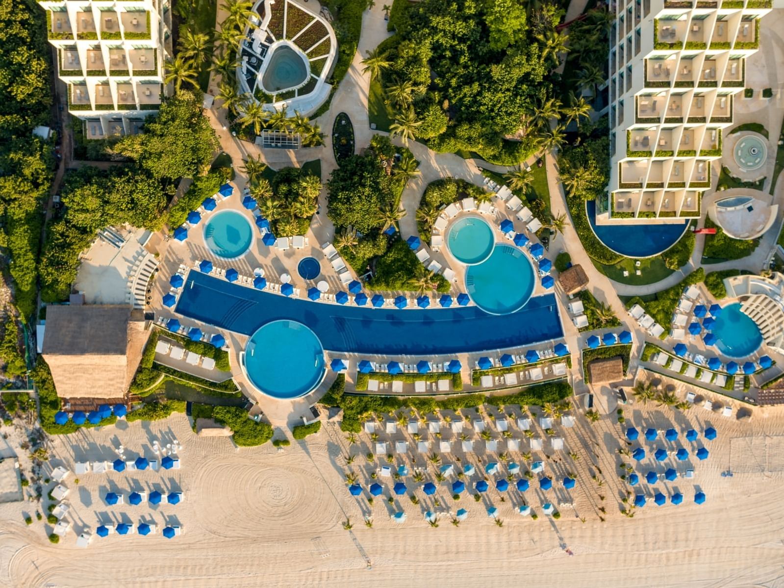 Aerial view of Pool & Beach area with sunbeds at La Colección