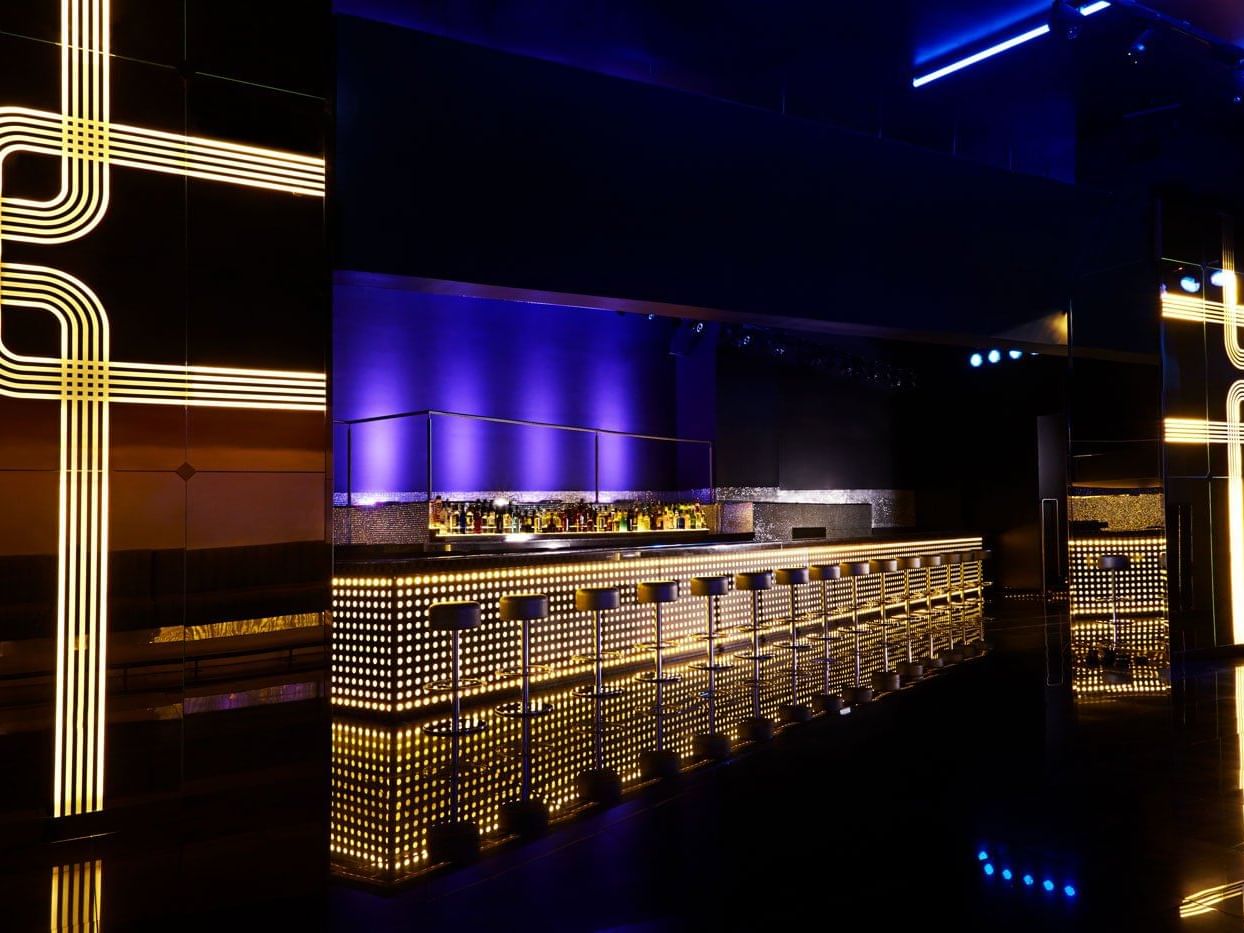 Bling with colorful neon lights and a sleek bar counter at Megapolis Hotel Panama