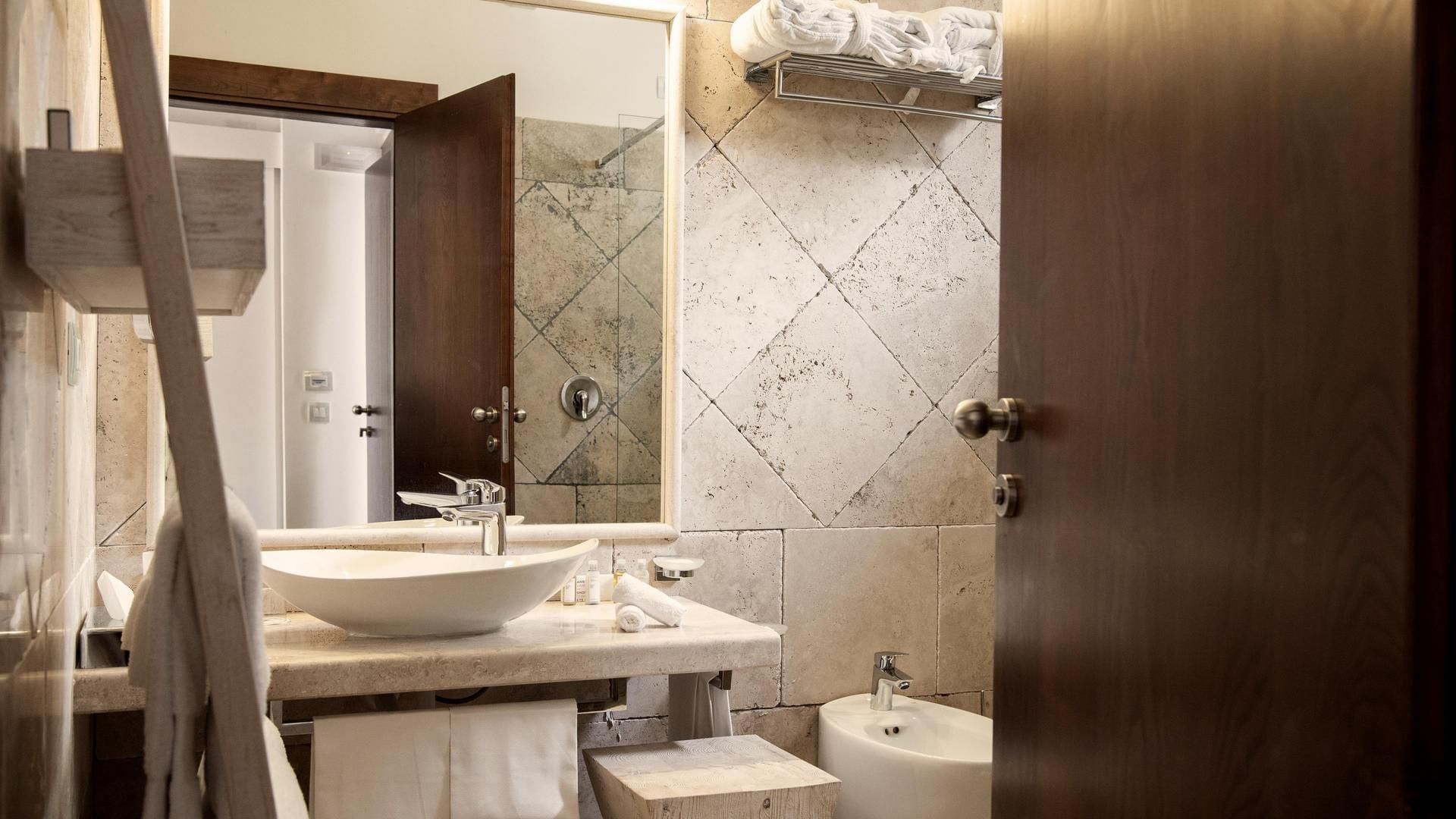 Bathroom vanity in Family Villa at Falkensteiner Hotels