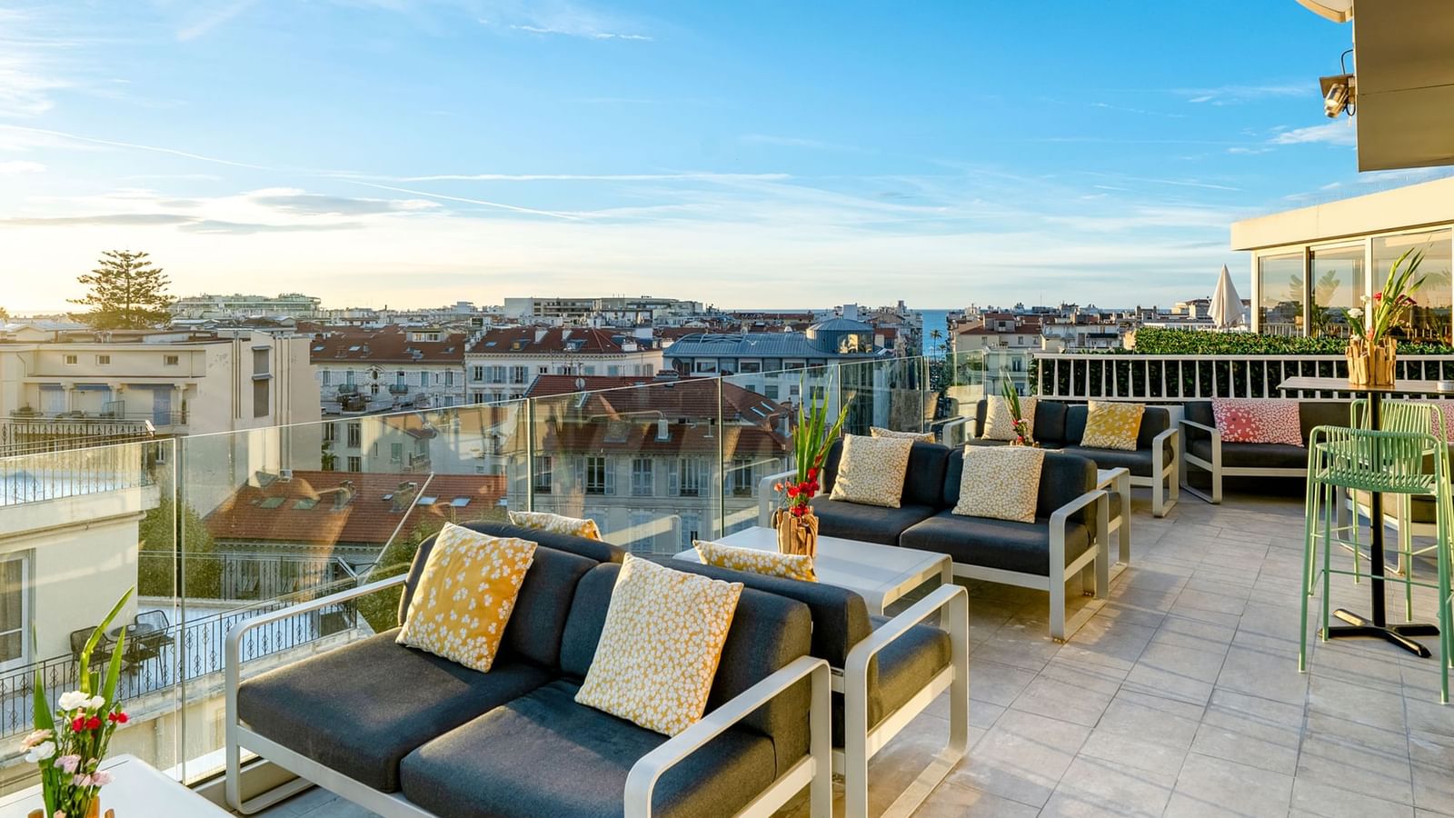Beautiful rooftop Bonobo’s Bar, featuring plush outdoor sofas and a scenic city skyline at Splendid Hotel & Spa Nice