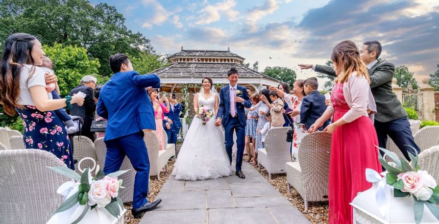 A wedding ceremony held outdoors at Easthampstead Park Hotel