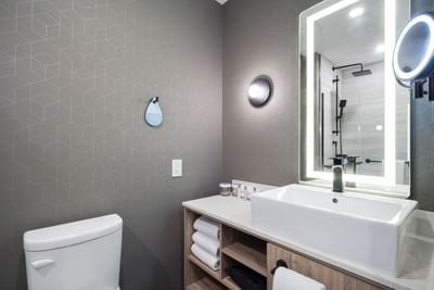 Interior of a bathroom at Sandman Signature Fort Worth Downtown