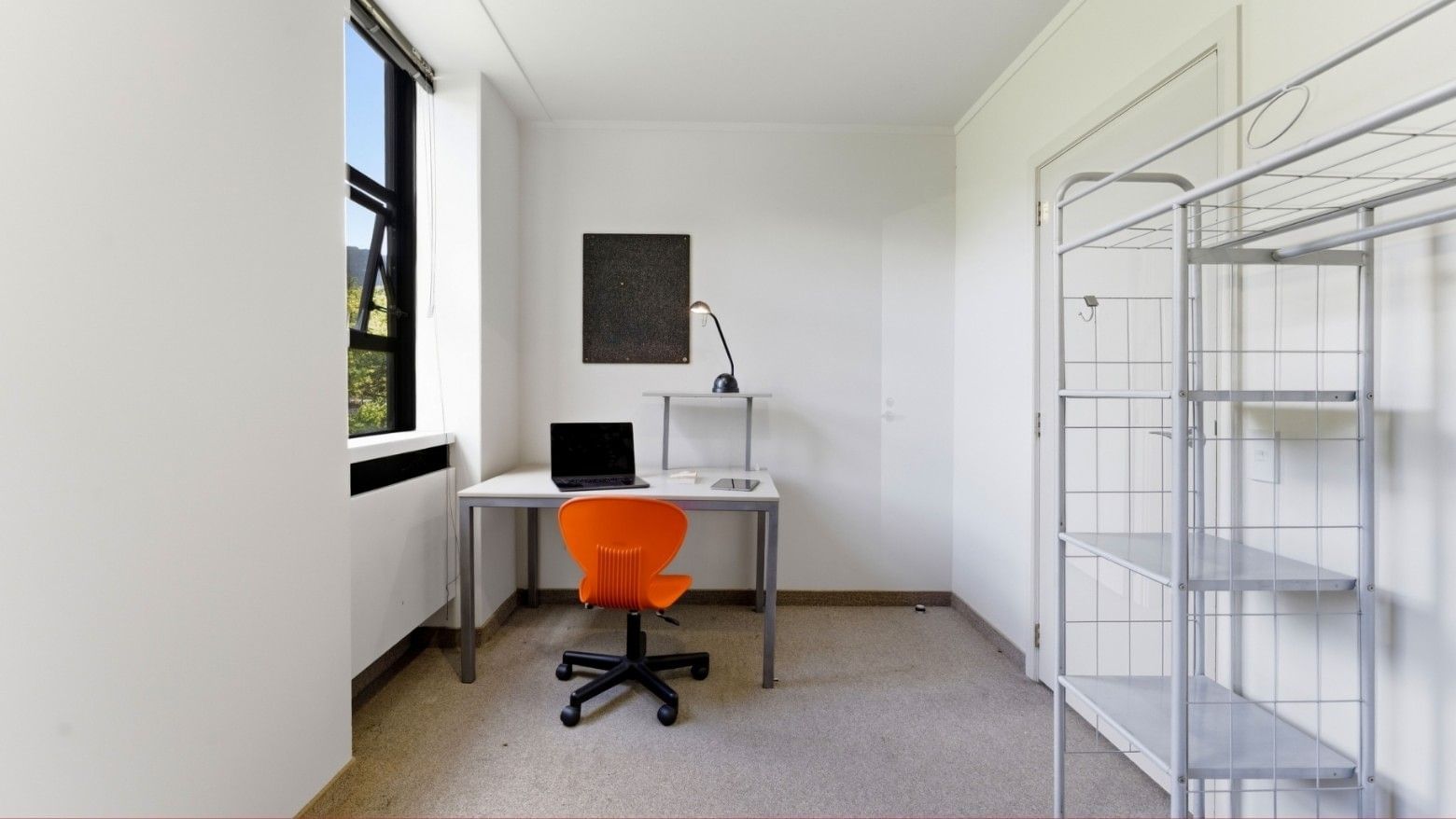 Desk with laptop and chair in a room at UniLodge Stafford House.