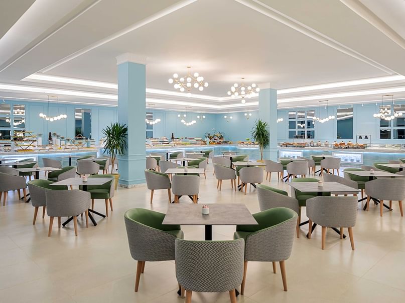 Empty Sweet Home restaurant with dining tables and chairs at Pickalbatros Dana Beach Resort Hurghada.