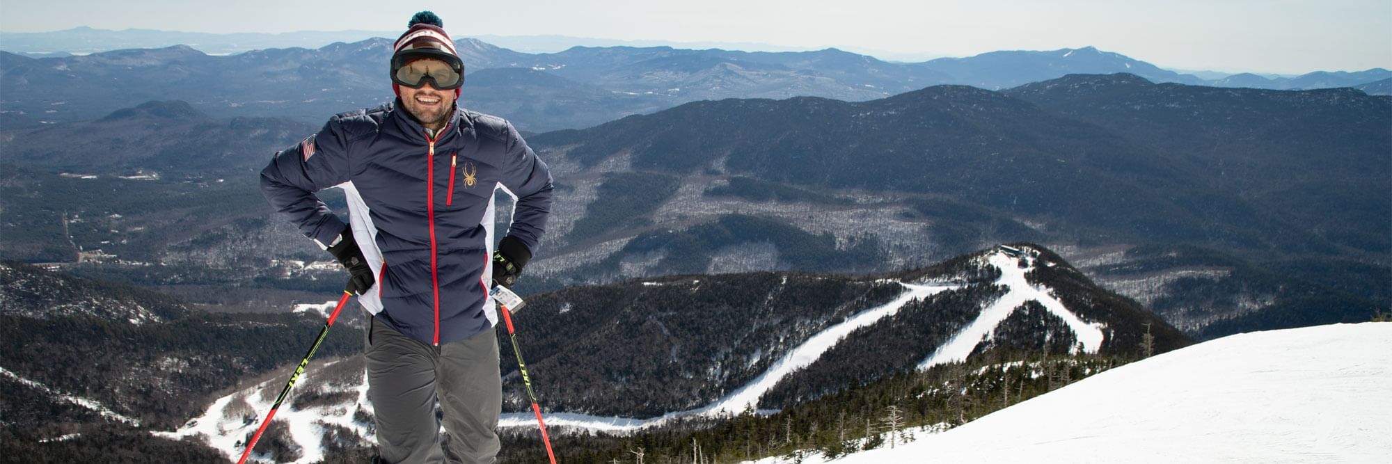 Man at Whiteface Mountain downhill skiing overlook.