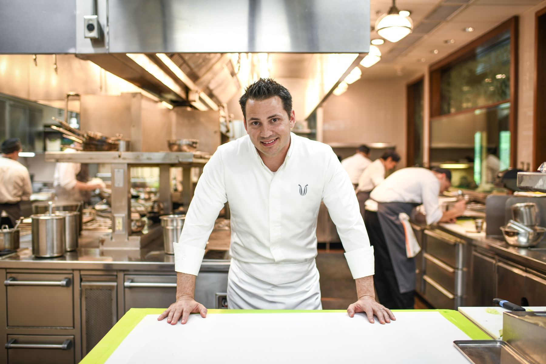 Chef Steve Devereaux Green in the kitchen posing for a photo at Umstead Hotel and Spa