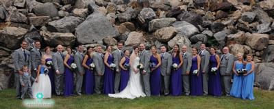 Group photo of wedding couple with others at Ethan Allen Hotel