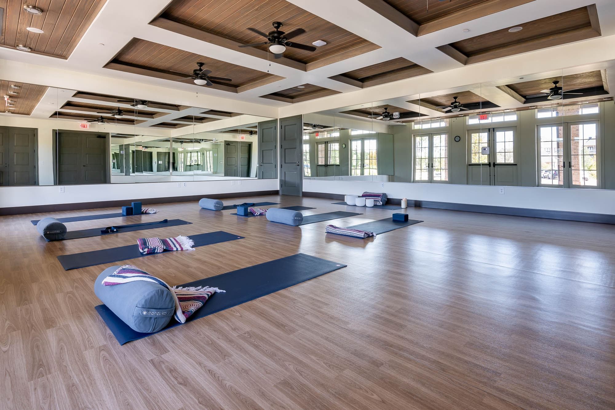 Gym mats on the floor of a spacious area at Camp Creek Inn