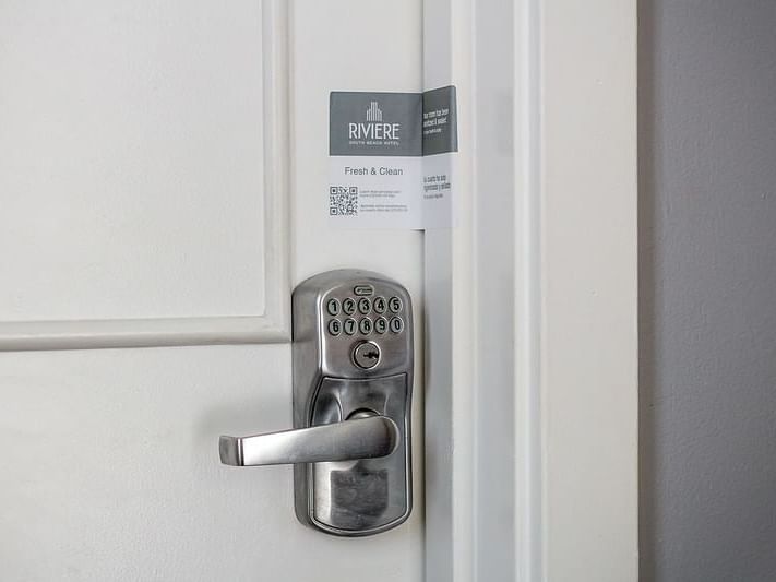 Closeup of a padlock on the hotel room door at DOT Hotels