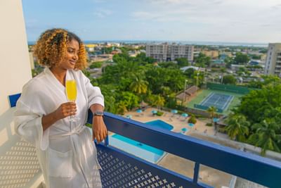 Woman with robe in balcony