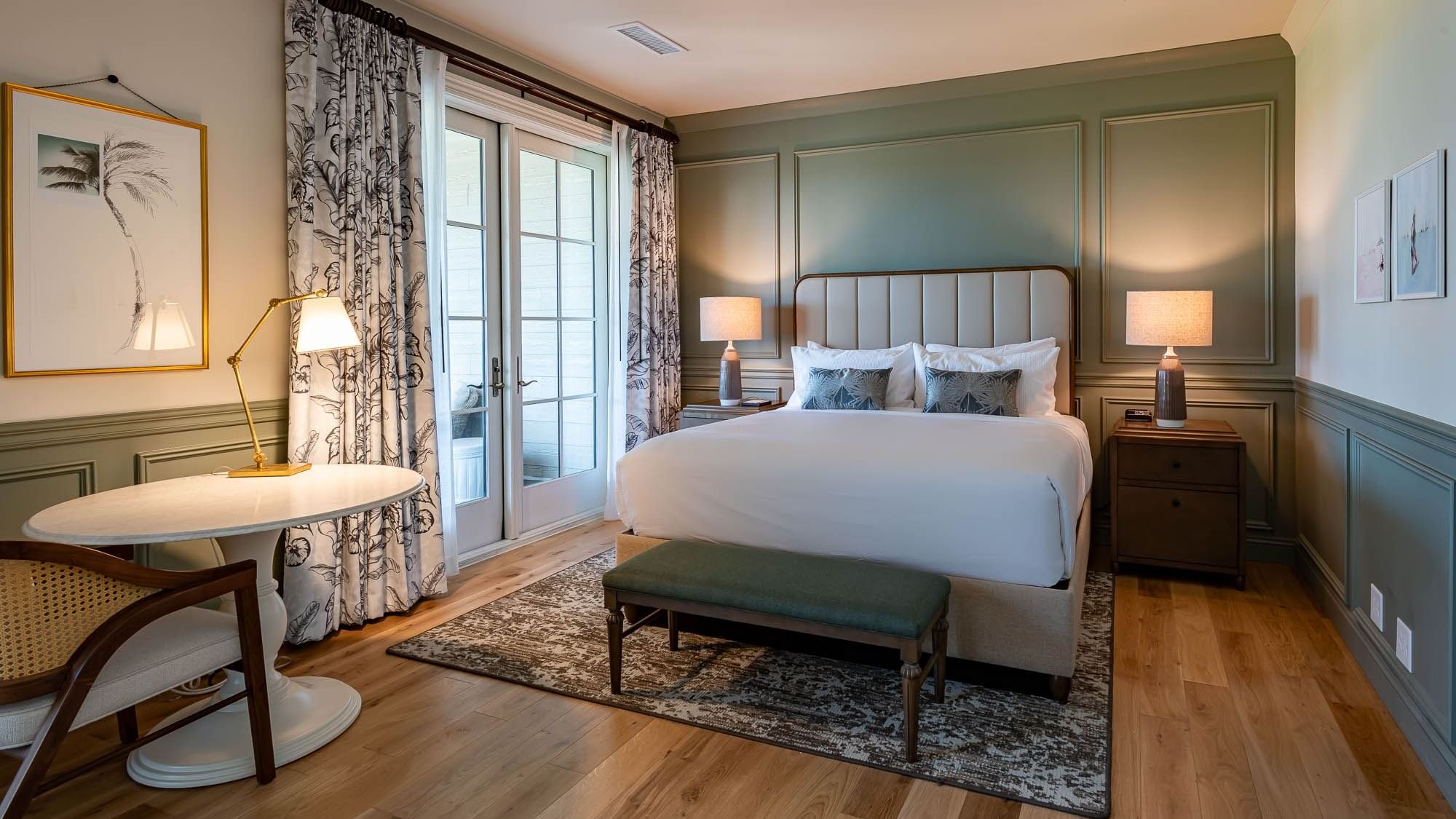 Work desk & King bed by the window in Junior Golf Suite at Camp Creek Inn