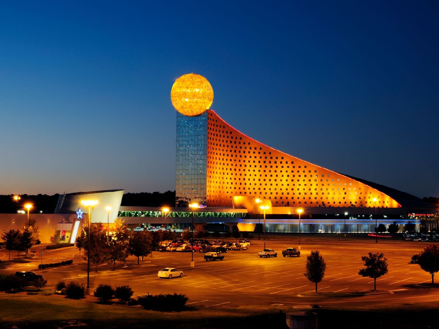 Exterior view of illuminated Golden Moon Hotel & Casino near Pearl River Resorts