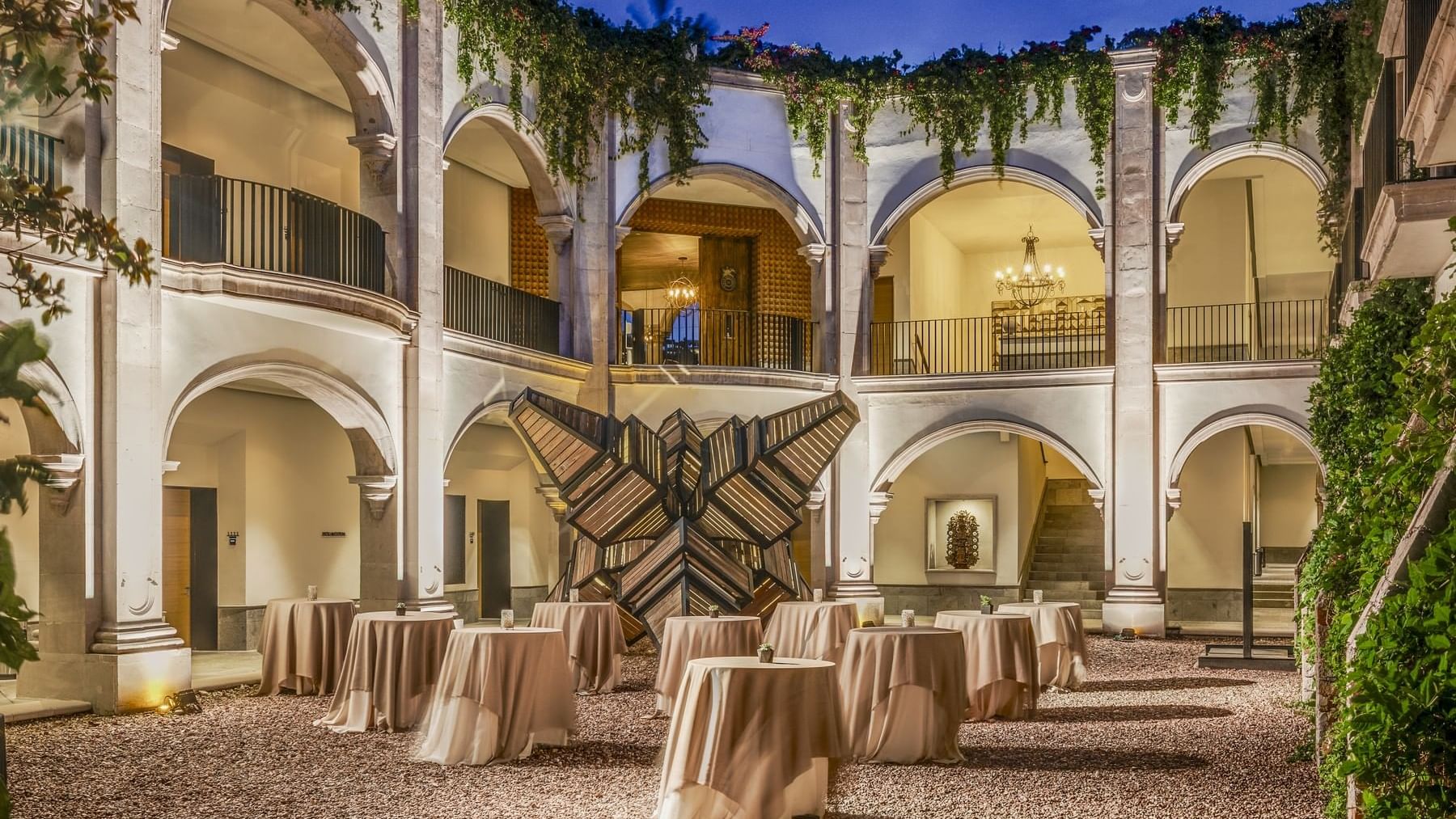 Outdoor dining setup with tables & chairs at Live Aqua Resorts