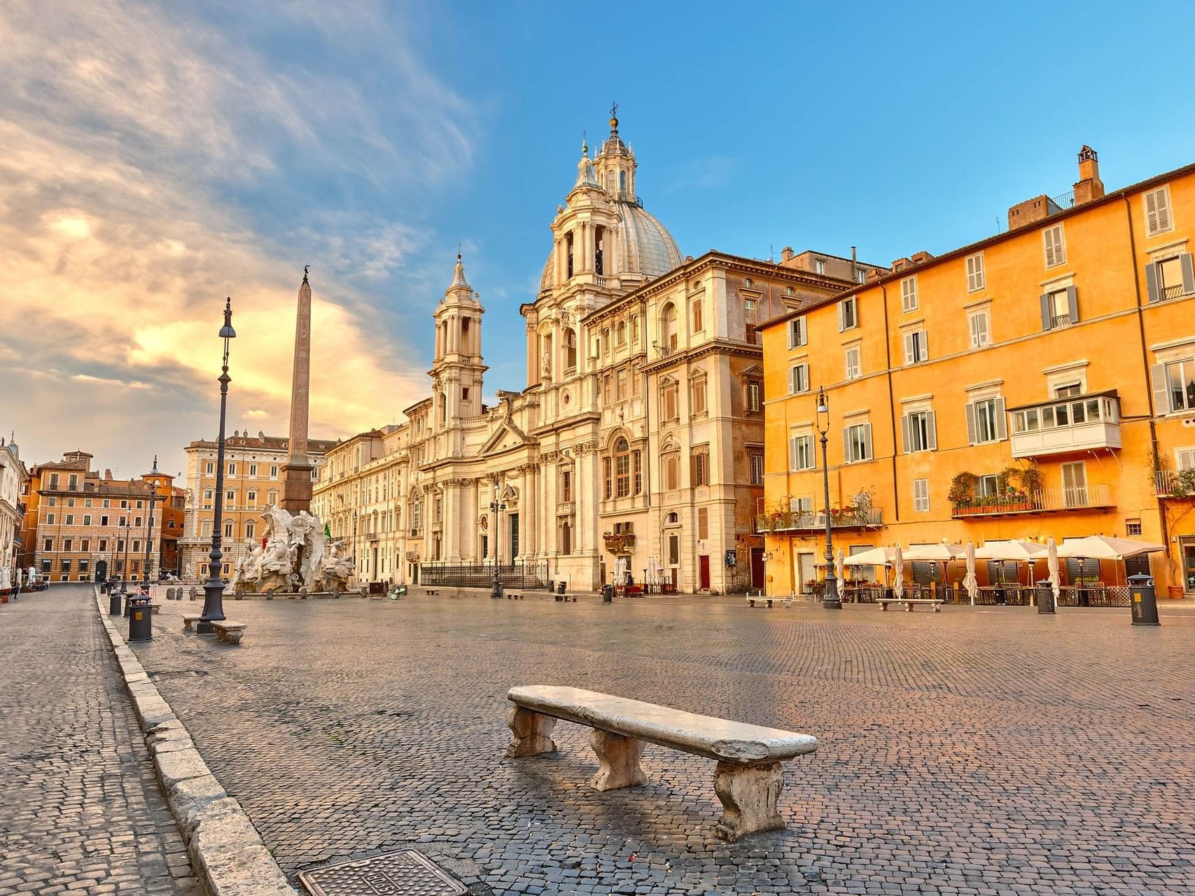 Sun setting on the buildings and empty streets of Piazza Navona near The Independent