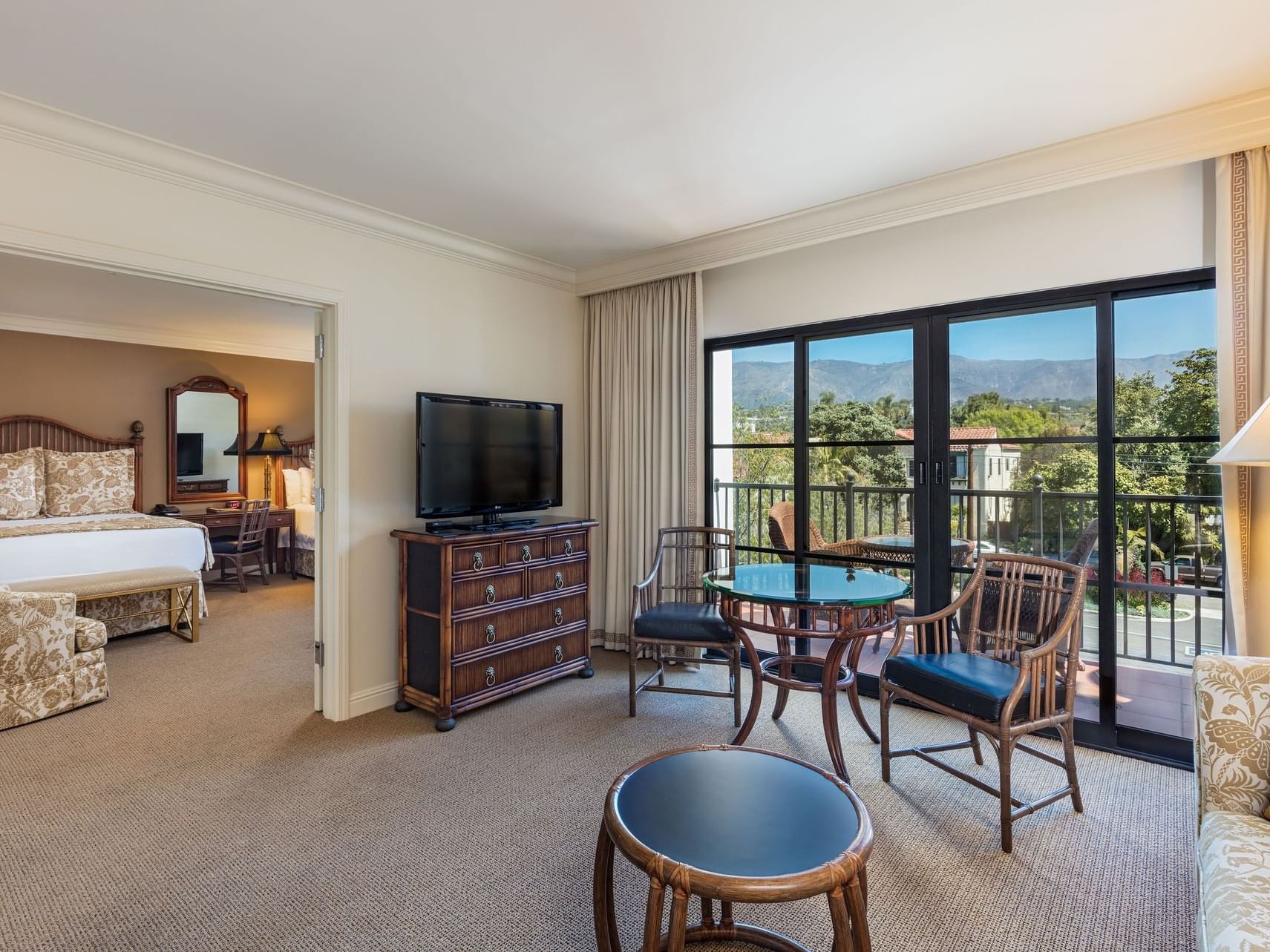 TV & balcony in Standard 2 Queen bedroom at Santa Barbara Inn