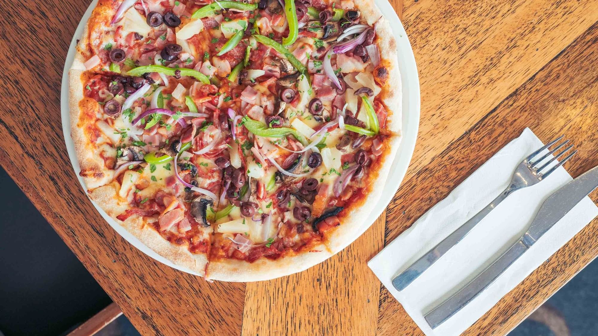 pizza from karinyas restaurant with delicious toppings