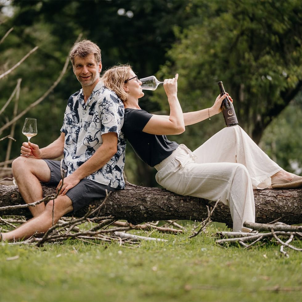 Couple enjoying wine outdoors at Falkensteiner Hotel Schladming