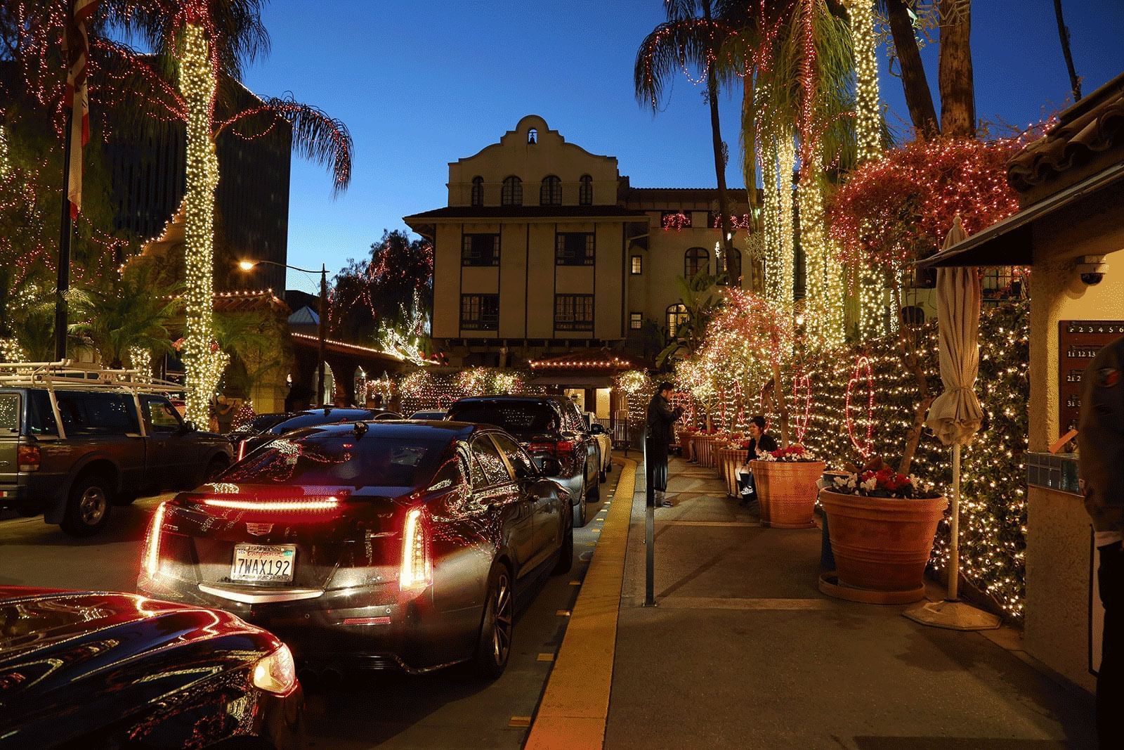 Cars parked on decorated street at Mission Inn Riverside